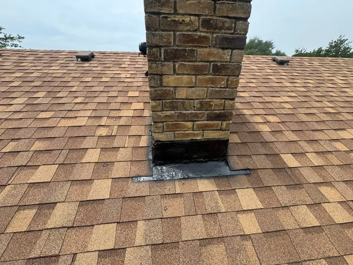 Chimney flashing sealed at the roofline — the kind of repair Chimney Standard performs in Atascocita, TX